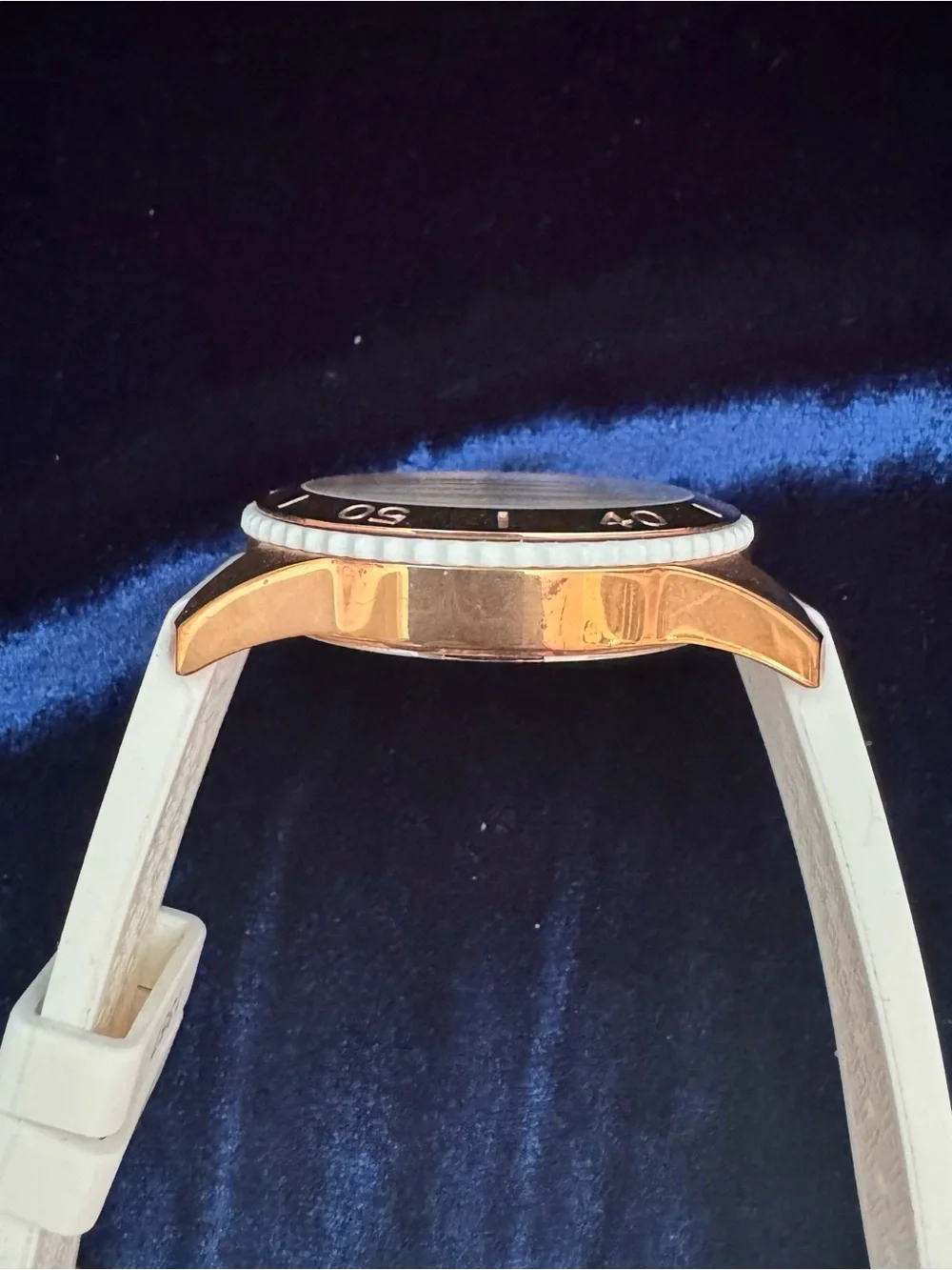 Tommy Hilfiger, vintage(ish), rose-gold tone with a rubber watch band. SO COOL!